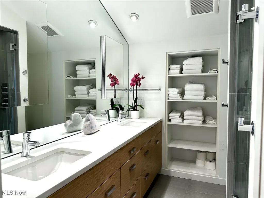 Bathroom with vanity and tile patterned floors
