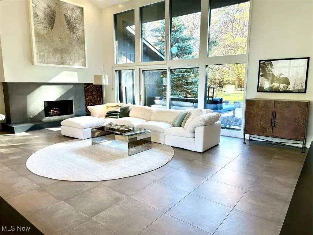 Living room with a towering ceiling and plenty of natural light