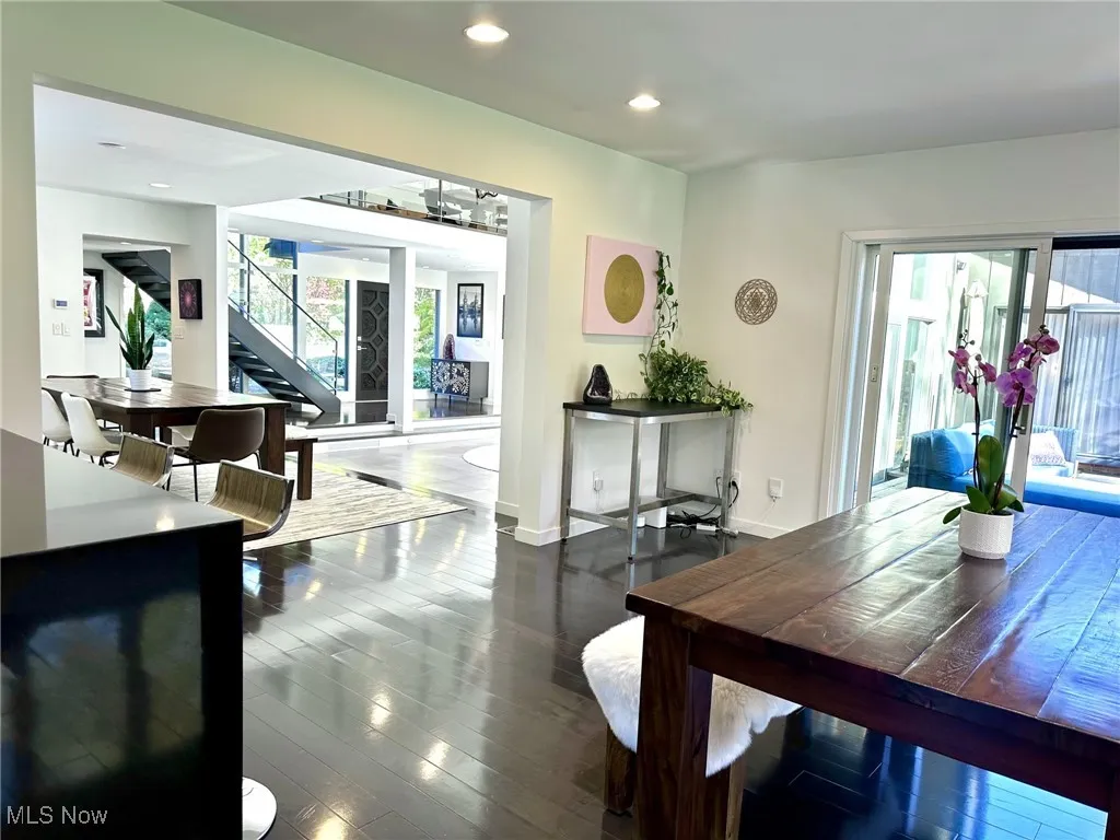 Dining room featuring dark wood-type flooring