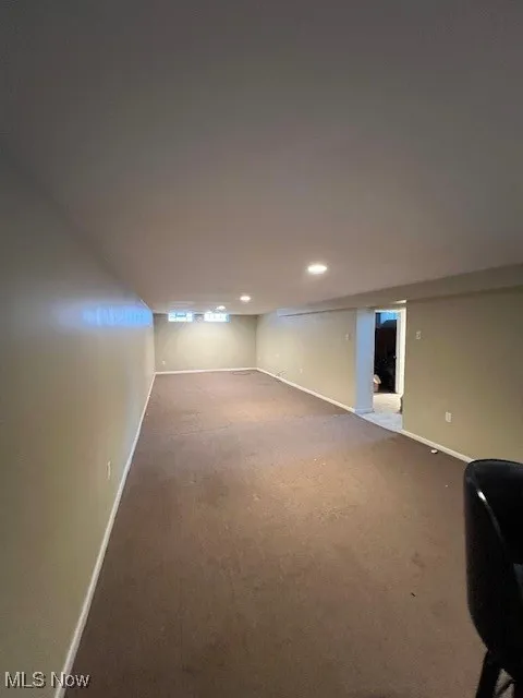 Basement with carpet flooring