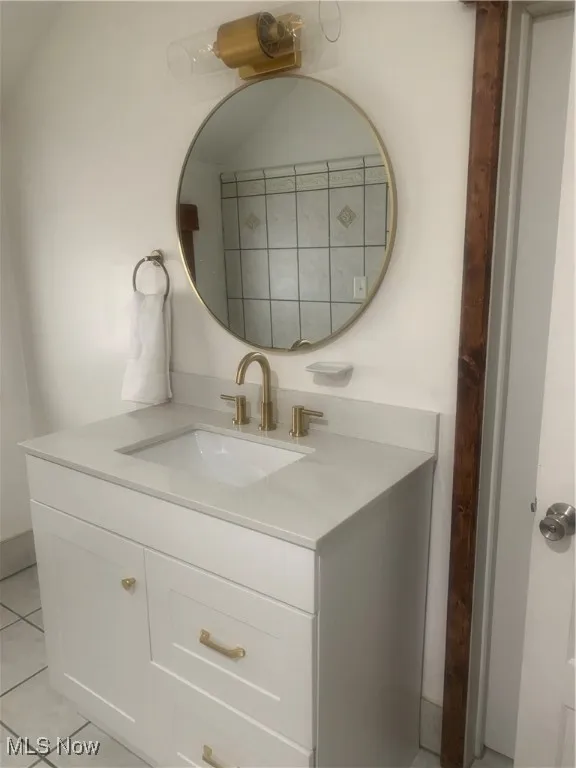 Bathroom with vanity and tile patterned floors