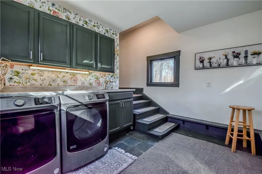 Laundry area with washer and dryer and cabinet space