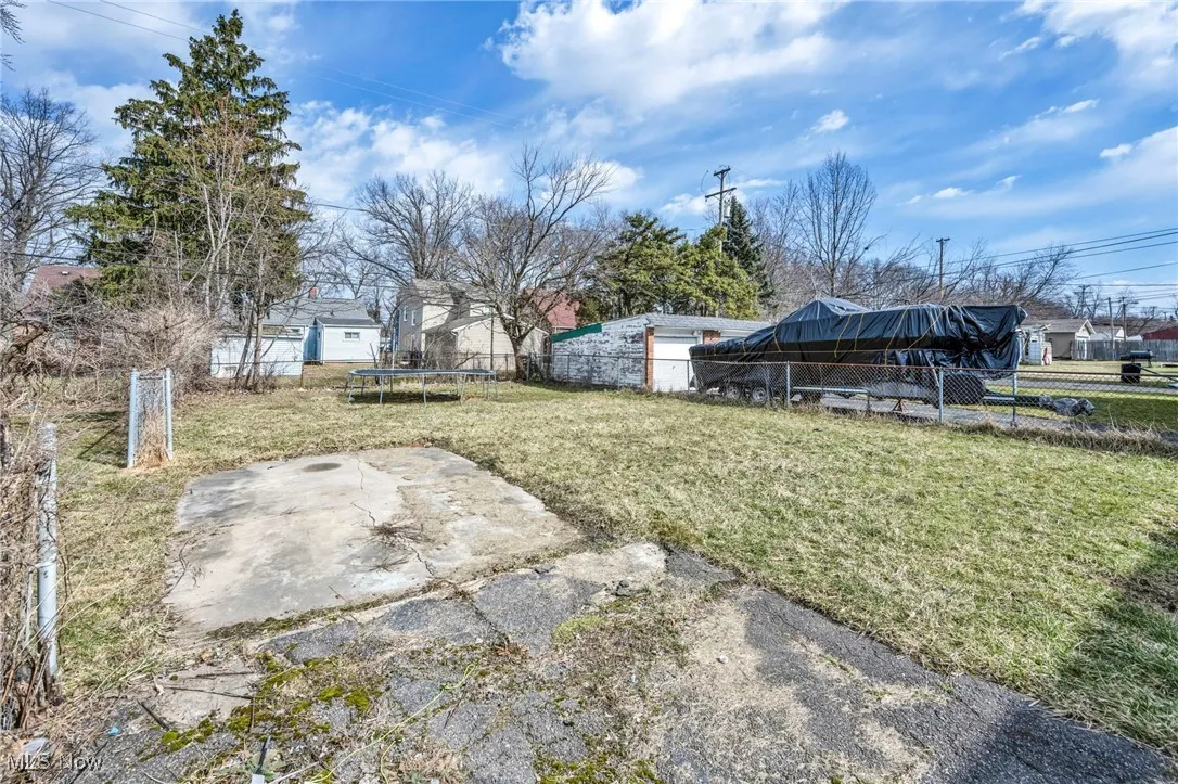 View of yard with a fenced backyard, a patio, and a trampoline