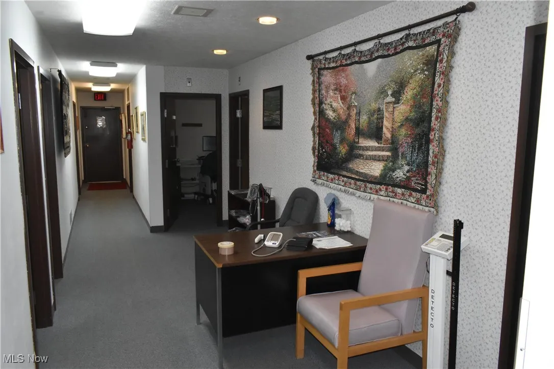 Hallway featuring carpet flooring
