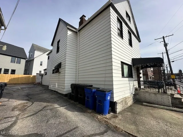 View of home's exterior featuring a chimney