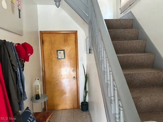 Staircase with tile patterned flooring