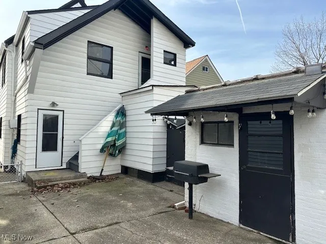 Back of property with a patio