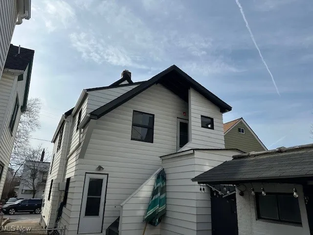 Back of property with a chimney