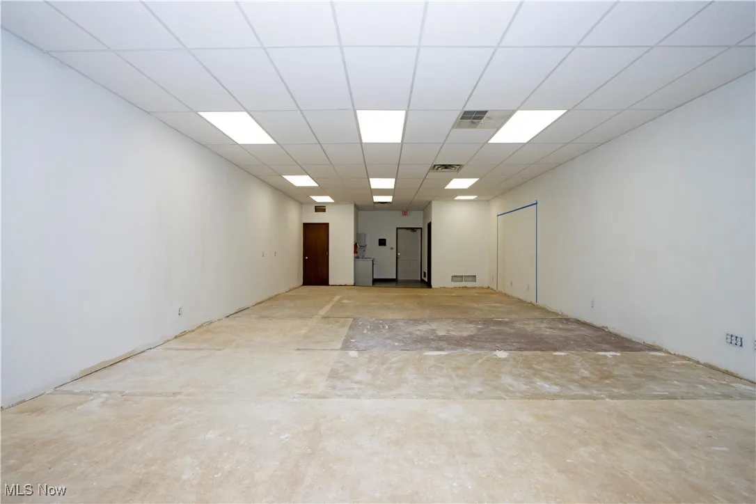Unfurnished room with a paneled ceiling