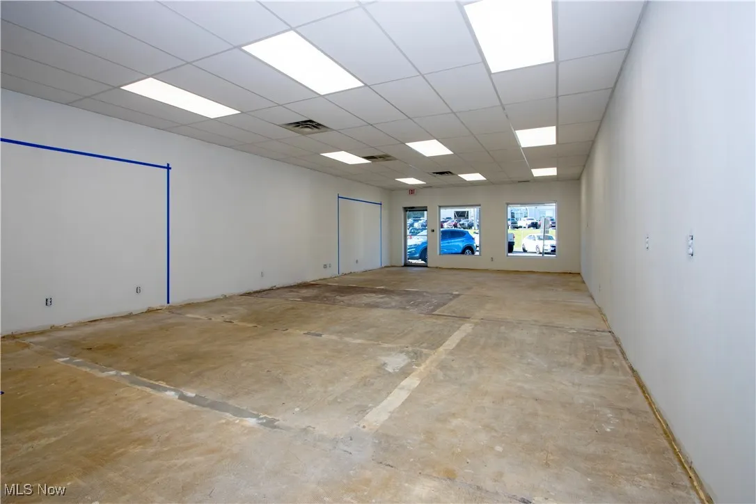 Unfurnished room with a drop ceiling