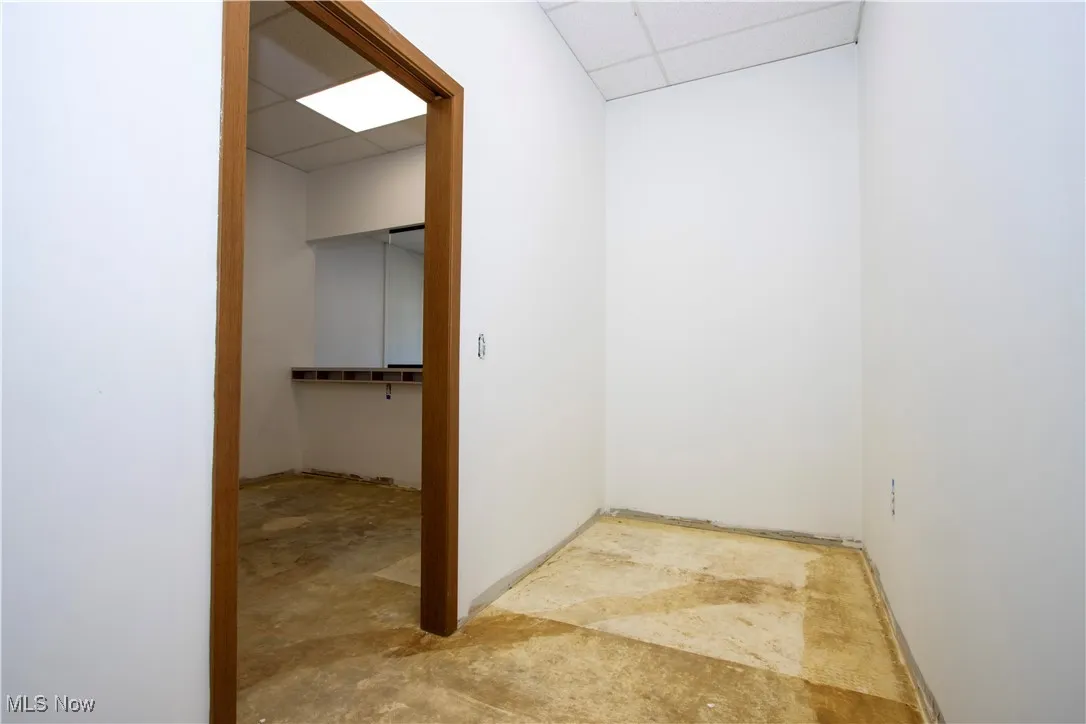 Hall with a paneled ceiling