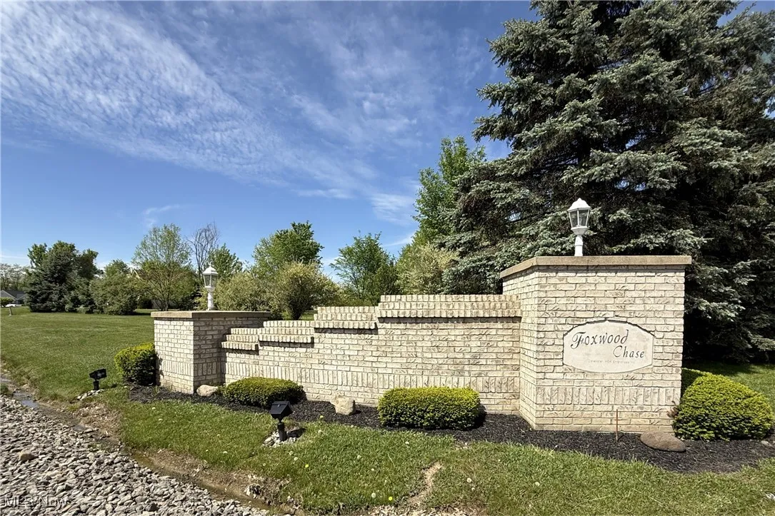 Community / neighborhood sign with a lawn