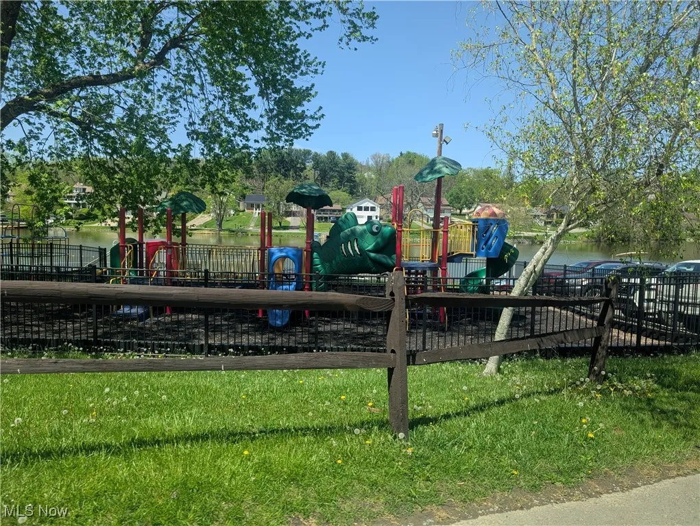 Community playground featuring fence