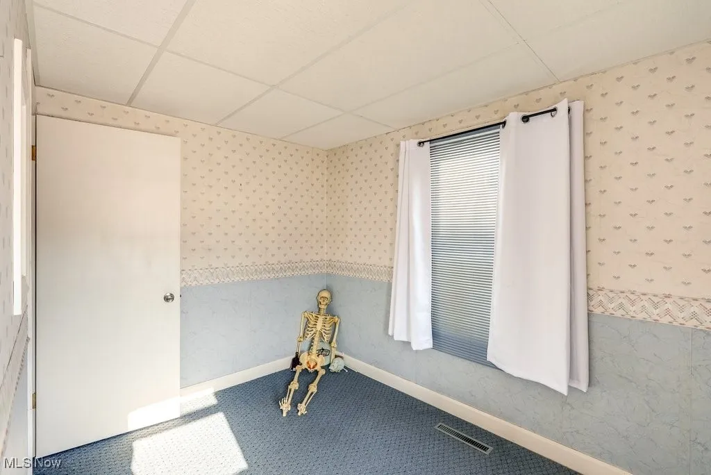 Carpeted main entry room