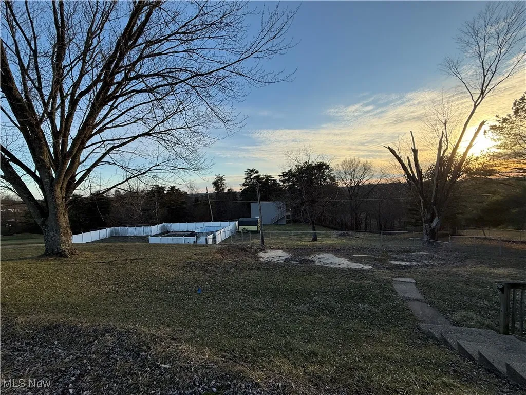 View of yard featuring fence