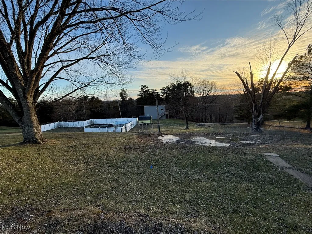 View of yard featuring fence