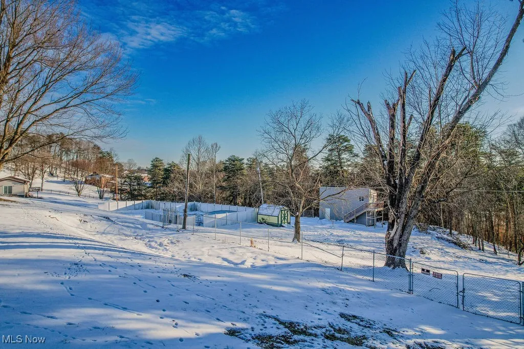View of yard layered in snow