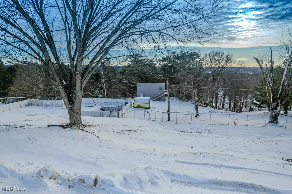 View of yard covered in snow