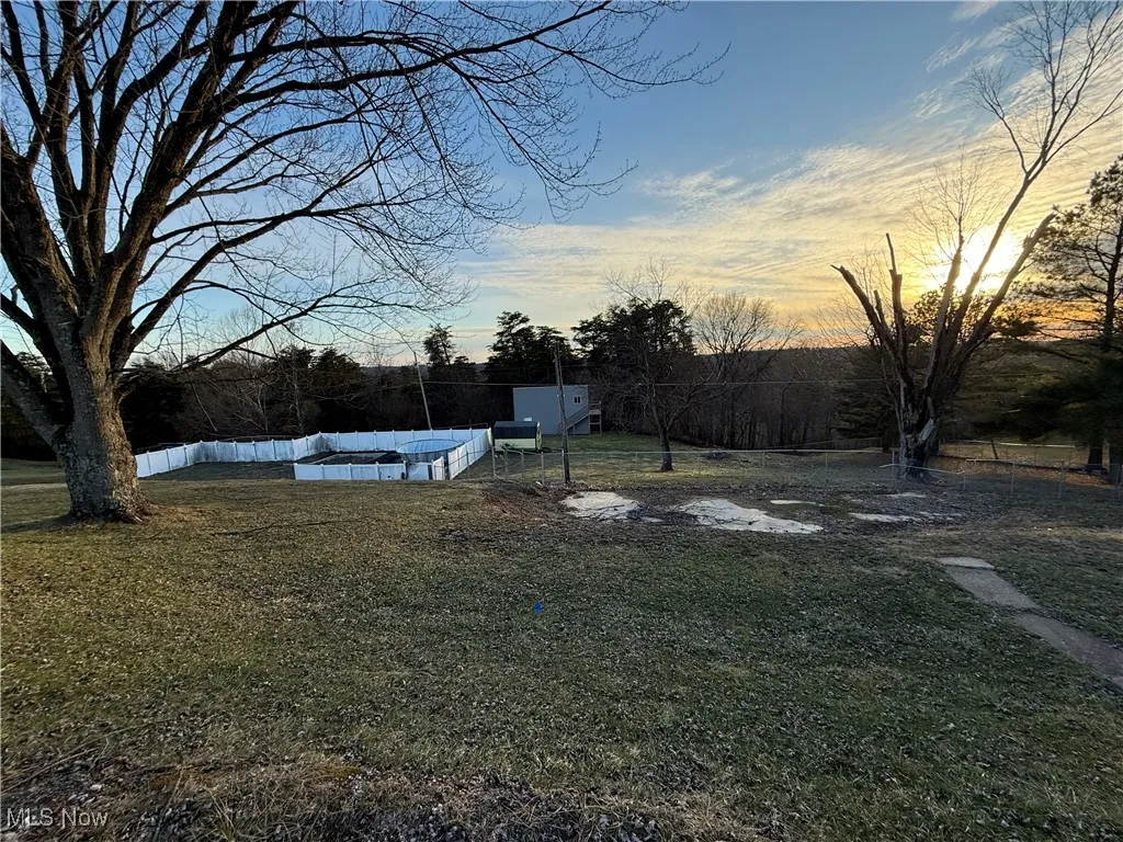 View of yard featuring fence