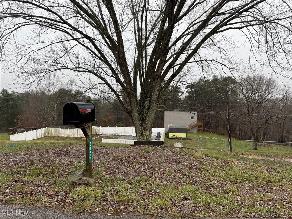 View of yard featuring fence