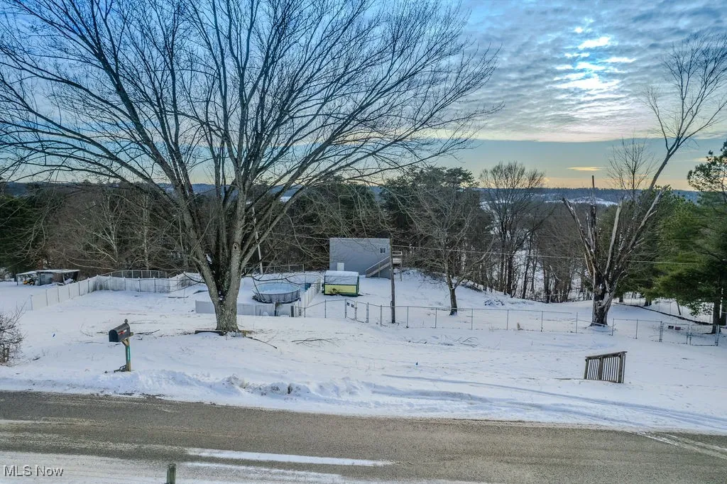 View of yard layered in snow