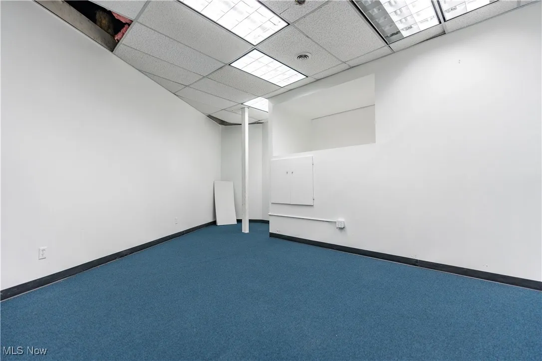 Unfurnished room with a paneled ceiling