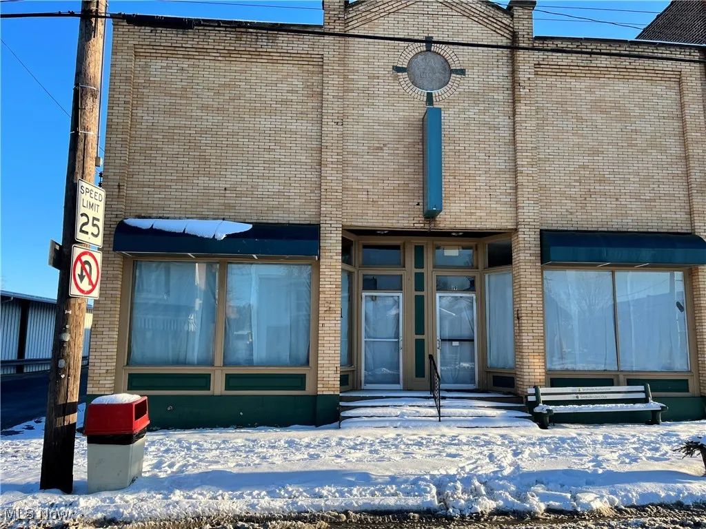 View of snow covered property entrance