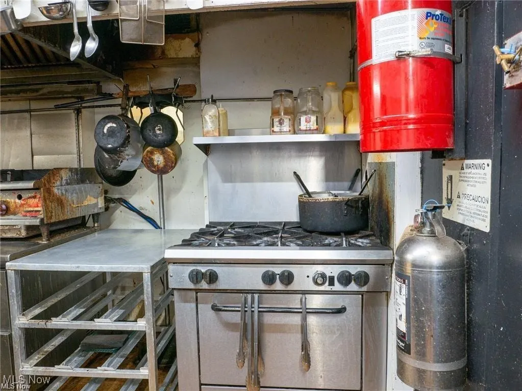 Kitchen with range with two ovens