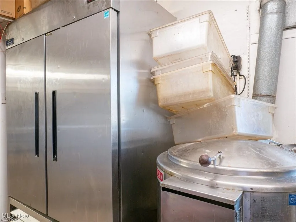 Kitchen with stainless steel fridge