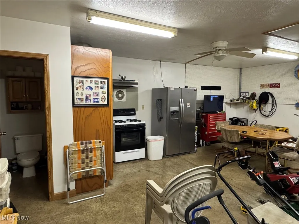 back of second garage with storage, air vent for stove