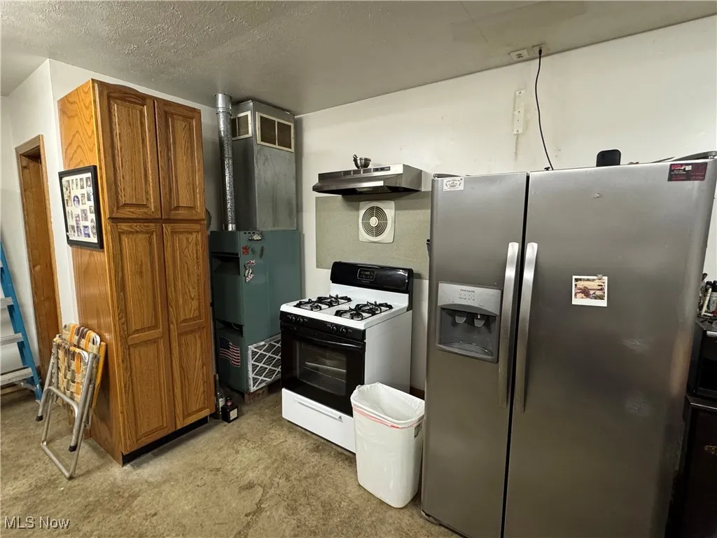 furnace and appliances in finished garage.
