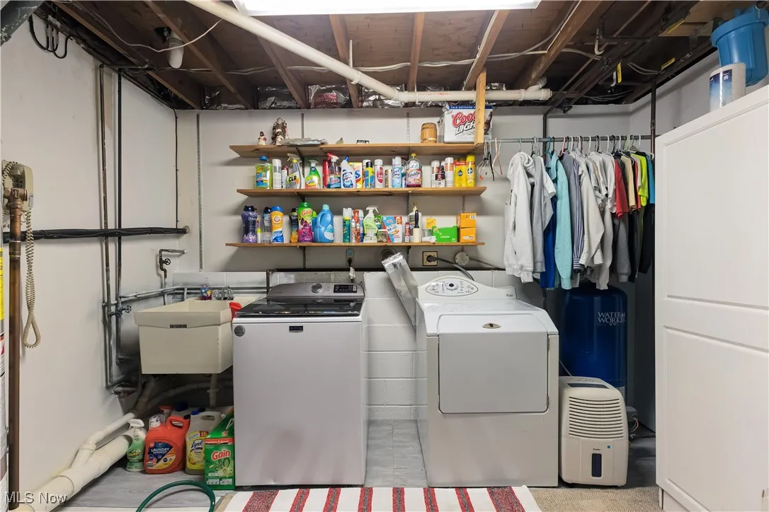 Large laundry with storage.