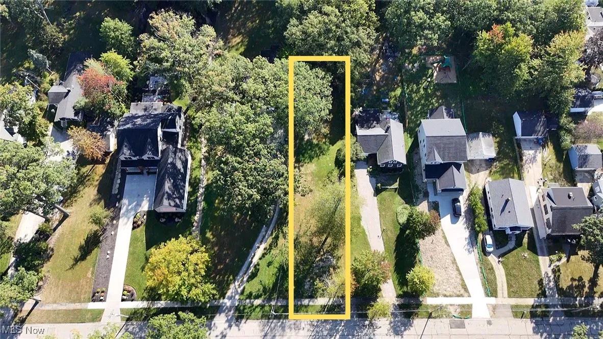 View of property location featuring property boundaries highlighted and nearby suburban area