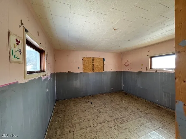 Basement with light parquet floors