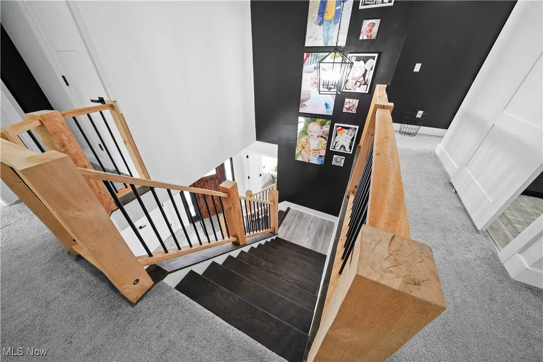Stairs featuring carpet flooring