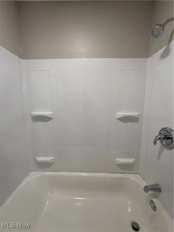 Bathroom featuring  shower combination