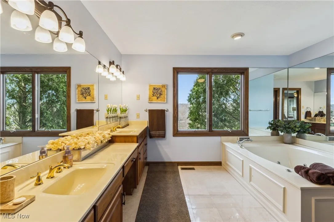 Primary Bathroom with new lighting and much room and storage