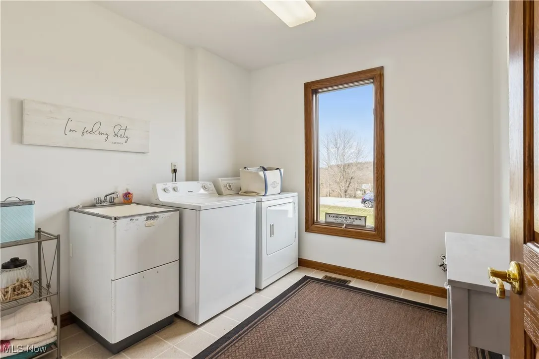 First Floor Laundry Room next to the Mudroom and next to one of the half bathrooms on the main floor