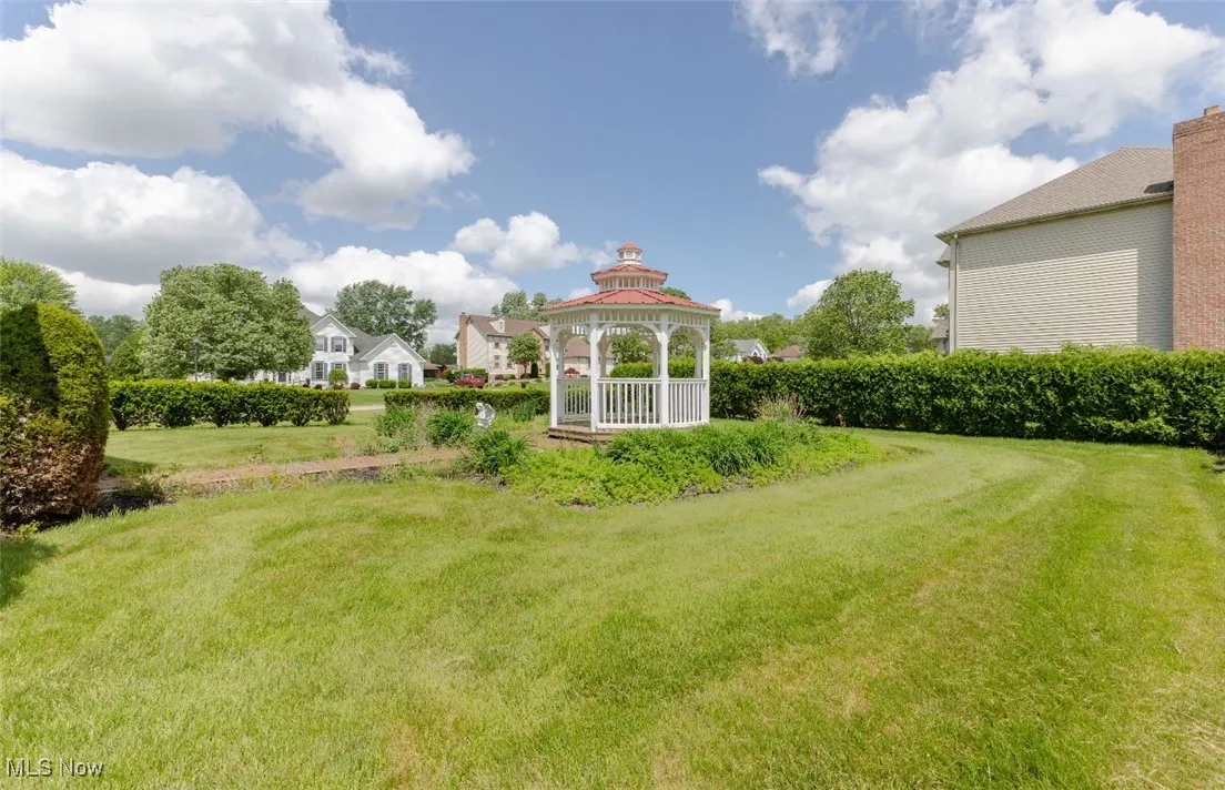 View of green lawn featuring a gazebo