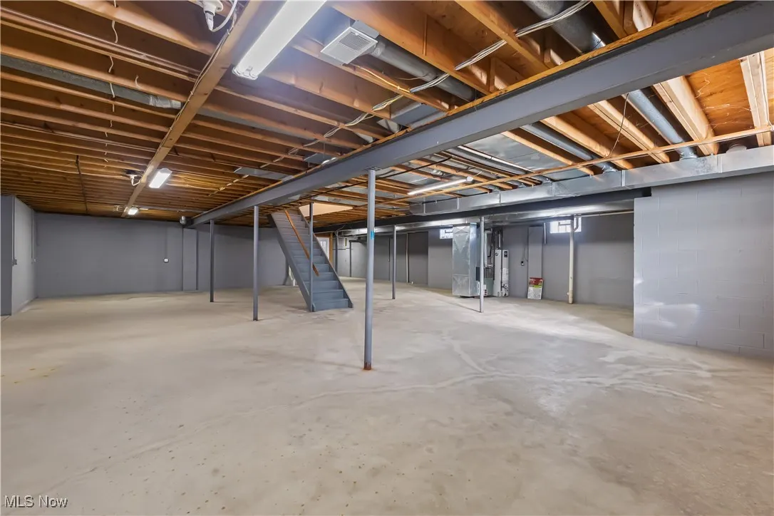 Basement featuring heating unit