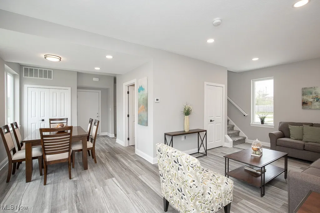 Living room with light hardwood / wood-style floors