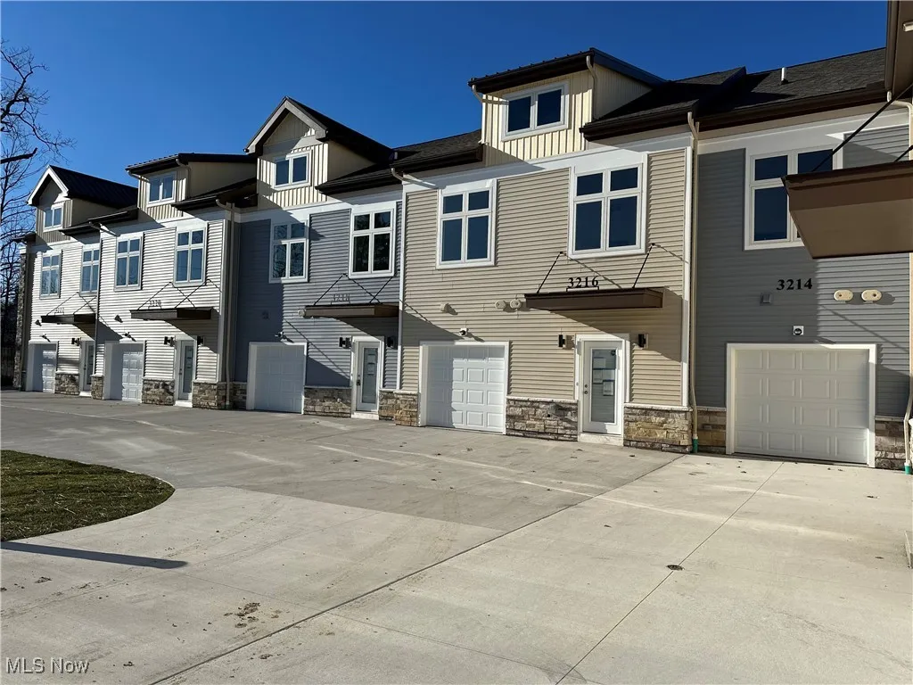 Townhome / multi-family property with a garage