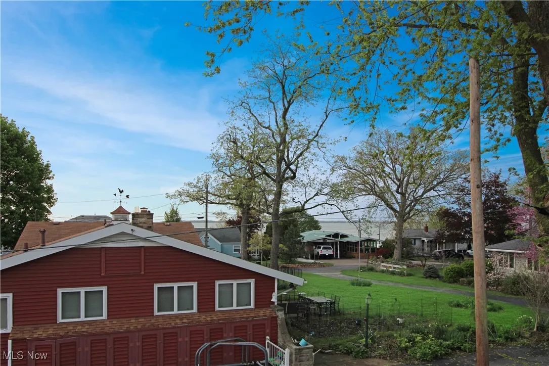 View of property exterior featuring fence