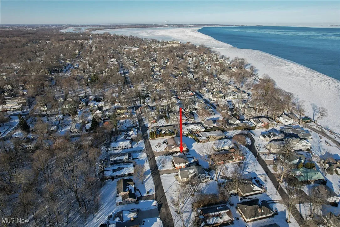 Drone / aerial view with a water view and a beach view