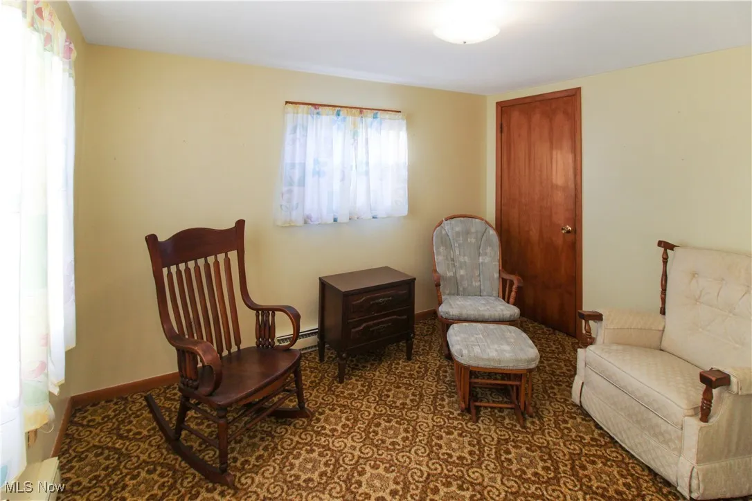 Sitting room with a baseboard heating unit