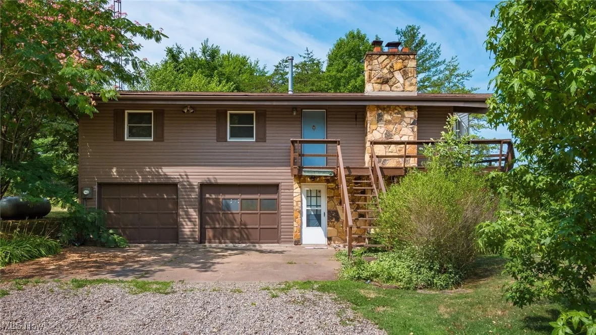 View of front of property featuring a garage