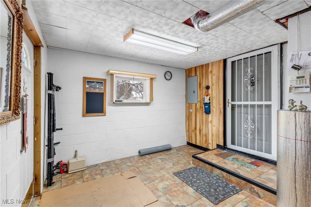 Doorway to property featuring electric panel