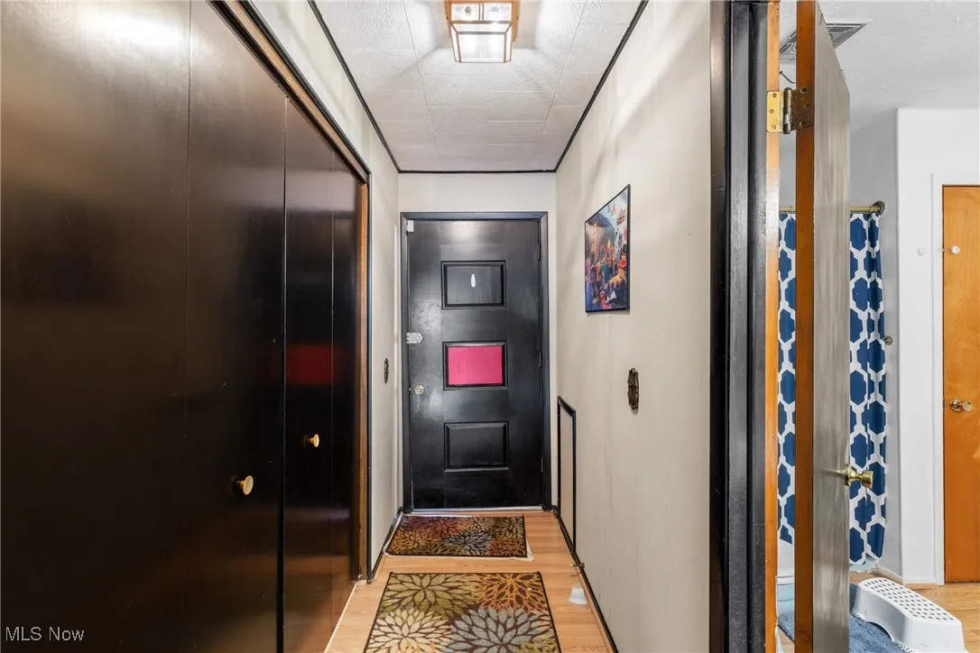 Doorway with light wood-type flooring
