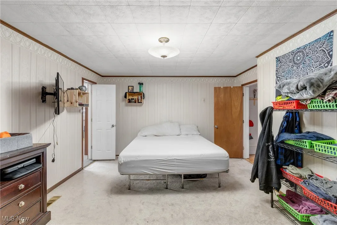 Bedroom with ornamental molding