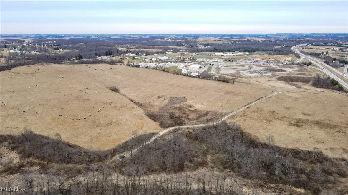 Birds eye view of property featuring a rural view